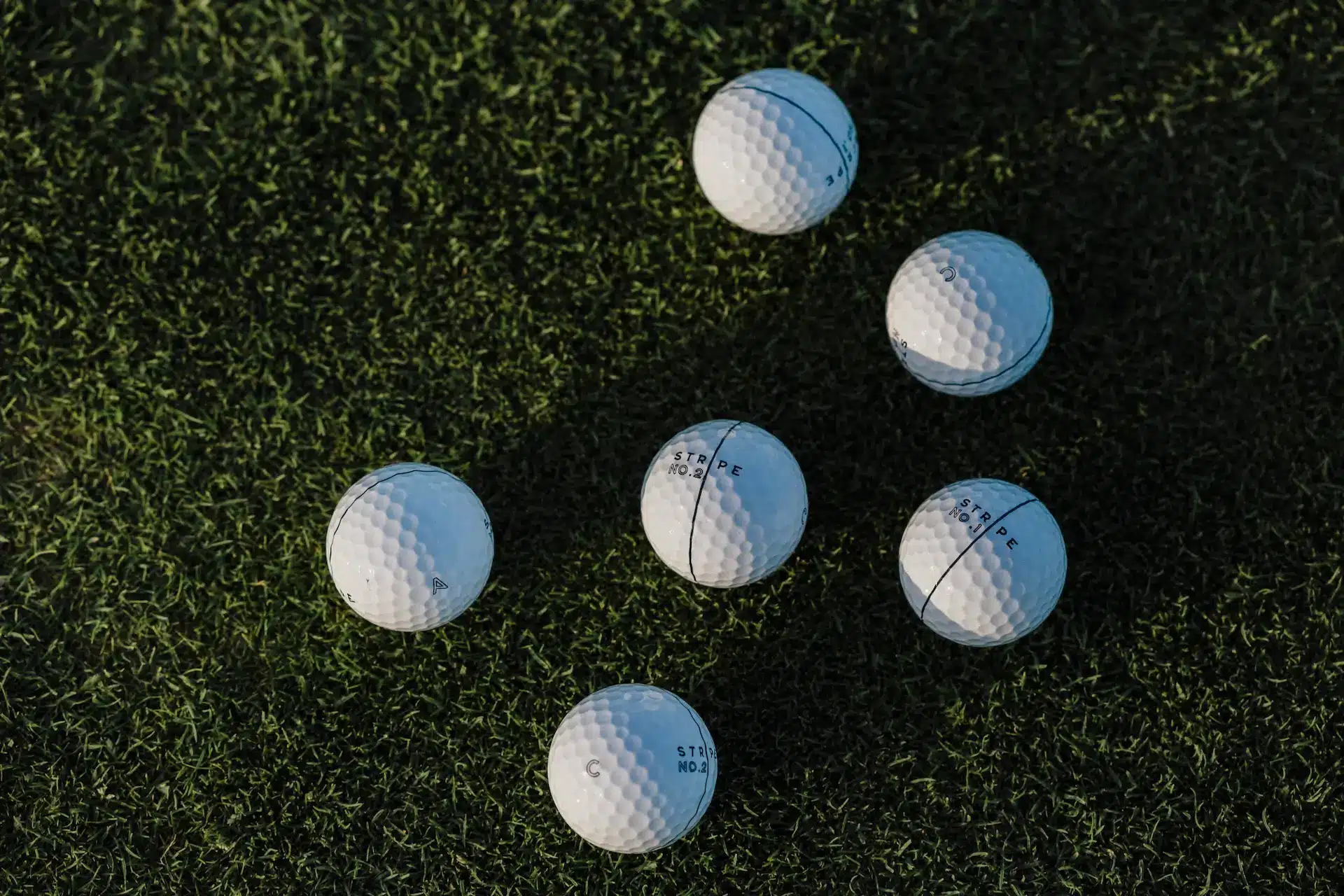 Golf ball on fairway - Stripe golf